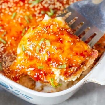 crab rangoon dip being portioned with spatula.