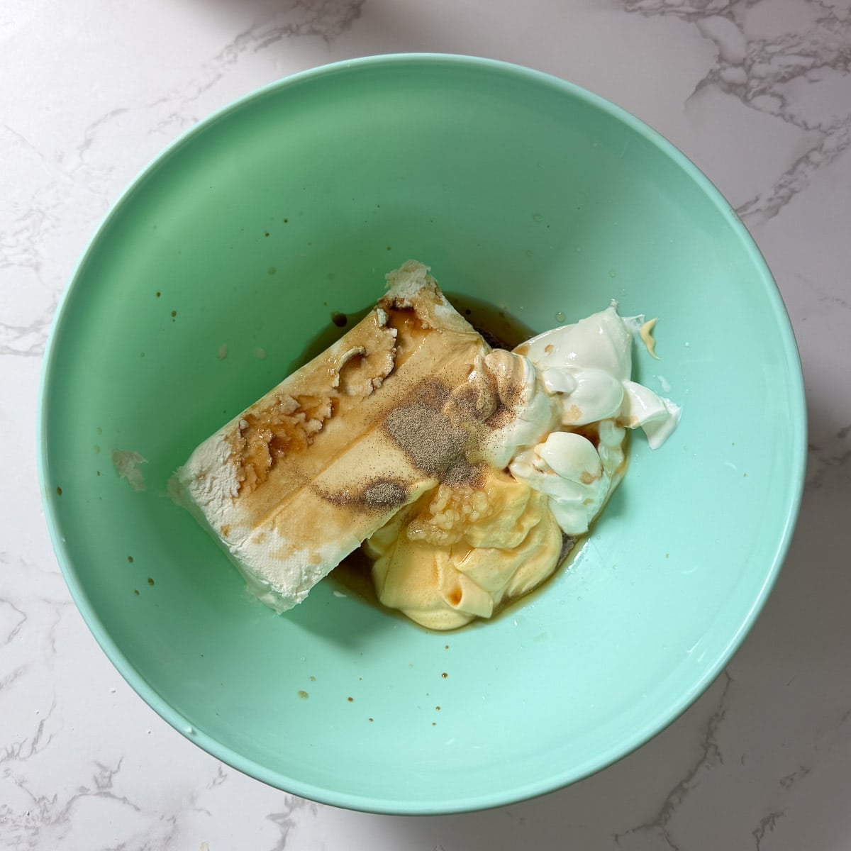 cream cheese and sauces in bowl.
