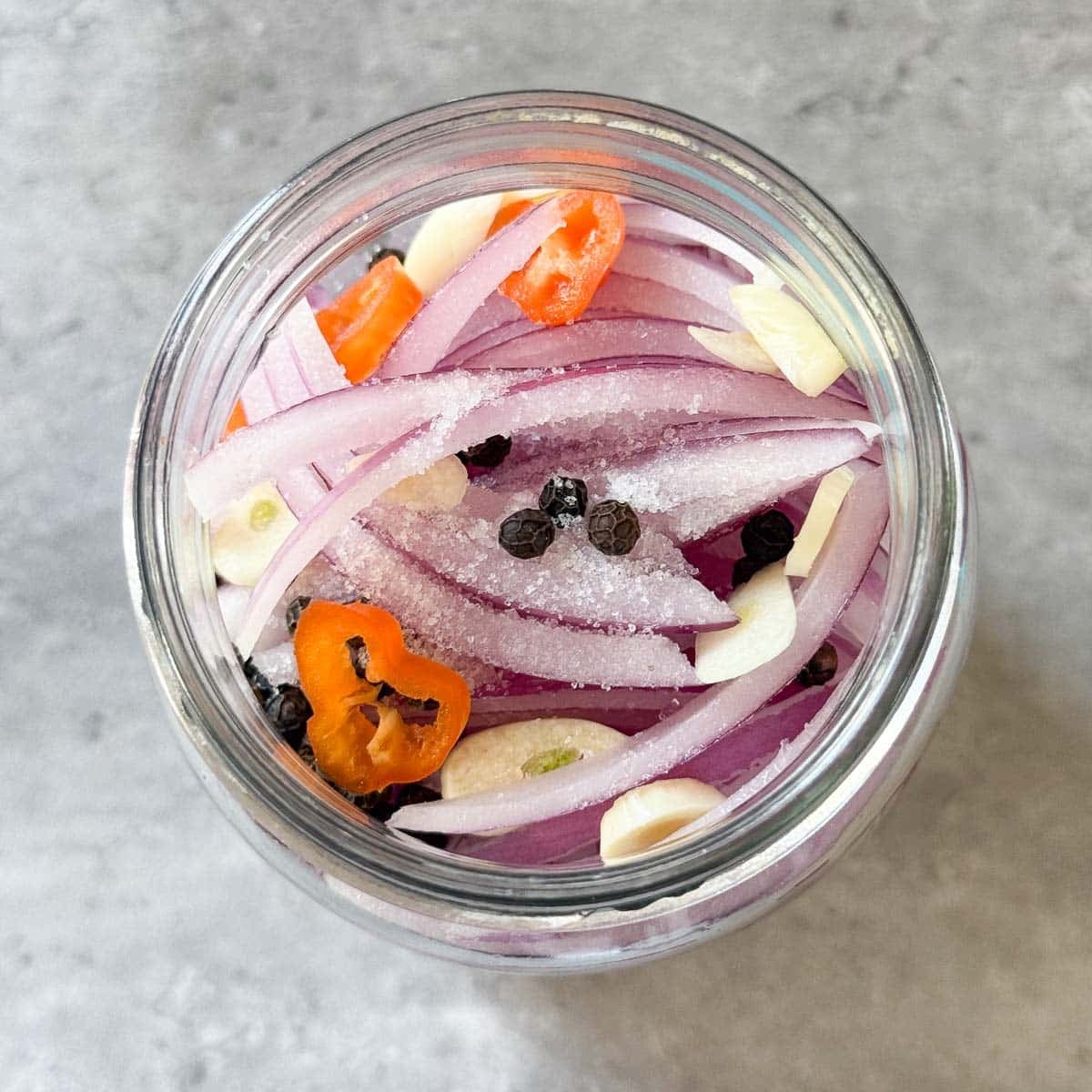 onions and aromatics in jar.
