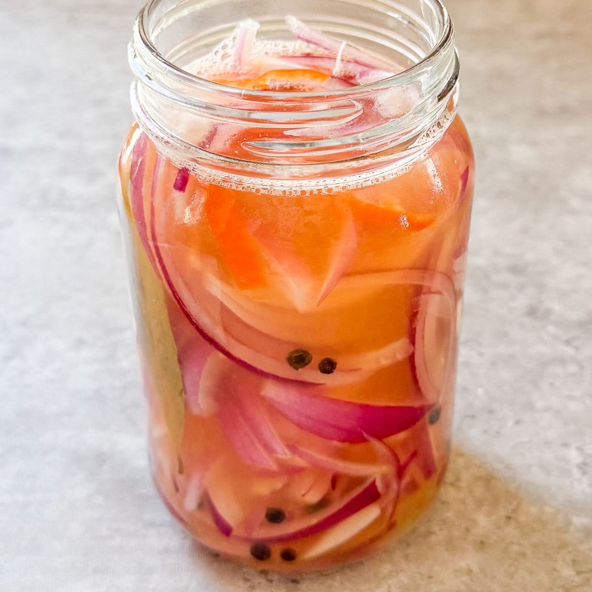 red onions pickling in brine.