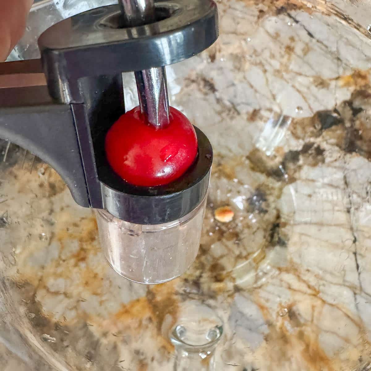cherry in cherry pitter