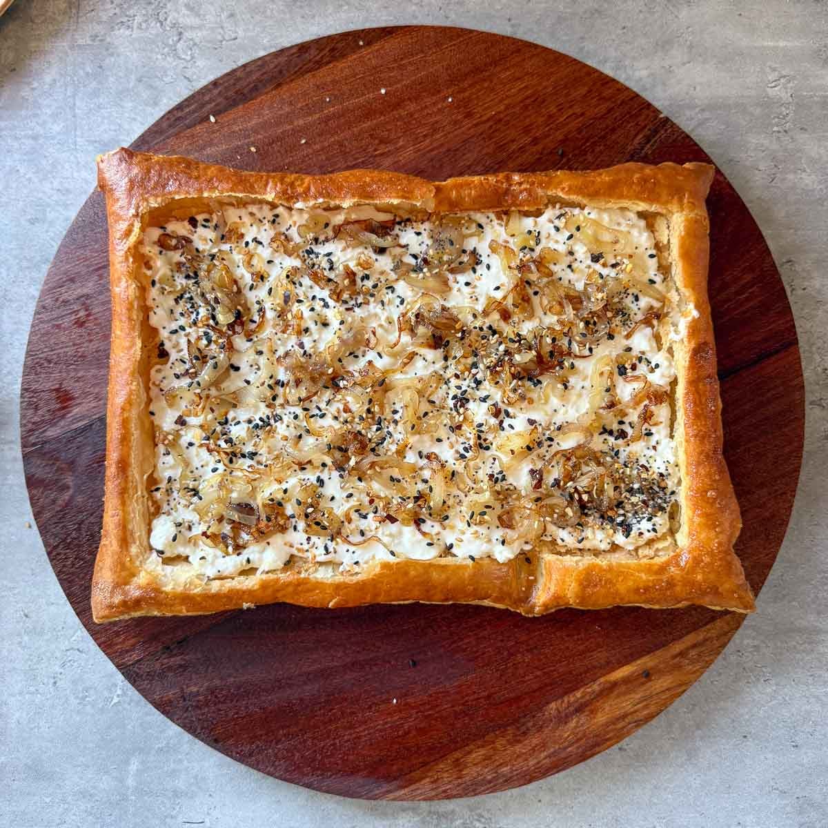 cheese, shallots, and seasonings added to puff pastry.