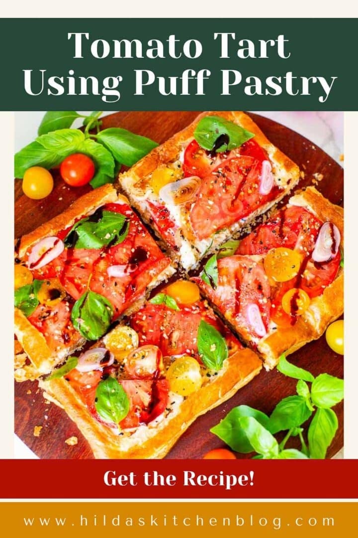 tomato tart using puff pastry surrounded by tomatoes and basil.