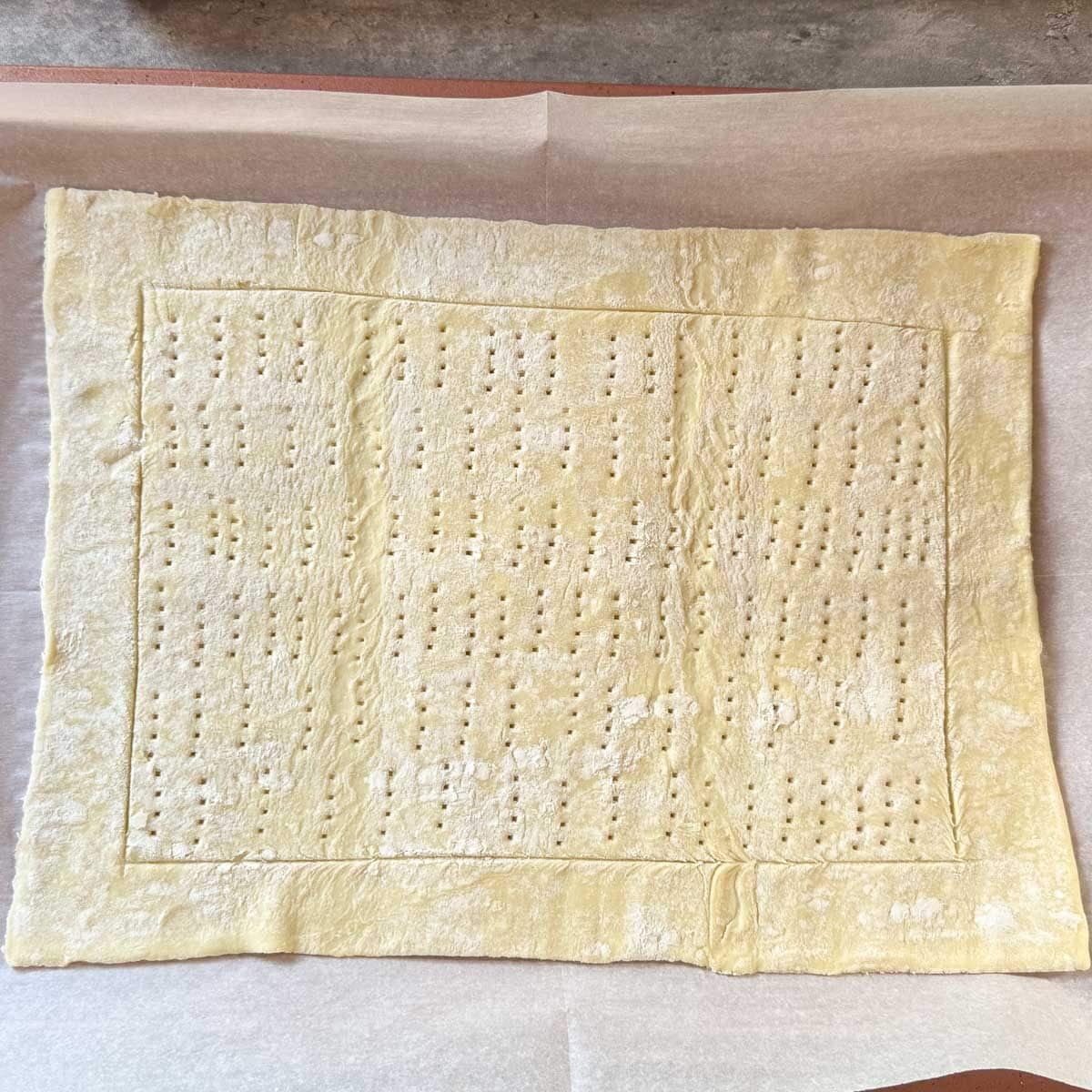 pastry sheet with border and docked center.