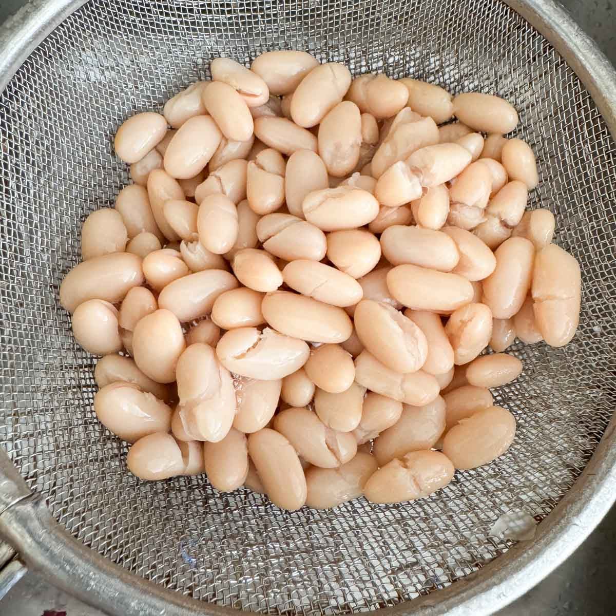 cannellini beans in a strainer