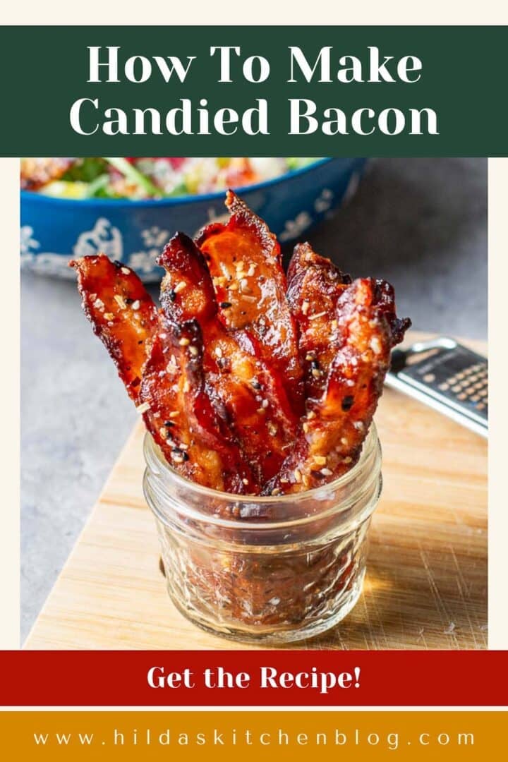 candied bacon strips standing up in jar.