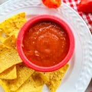 habanero salsa in a red bowl with chips