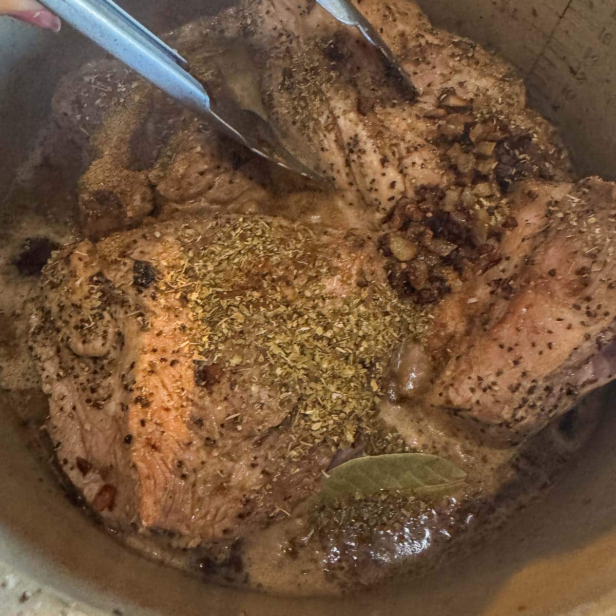 seasoned pork in a pot for pork pozole verde