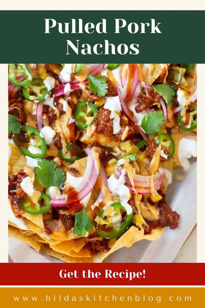 pulled pork nachos topped with pickled onions, cilantro, jalapenos, bbq sauce, etc.