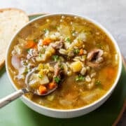 scotch broth in bowl with spoon.