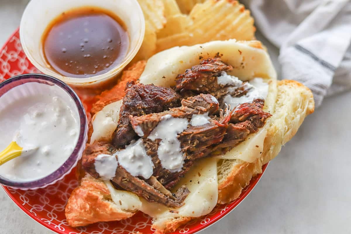 smoked beef sandwich with horseradish sauce and chips