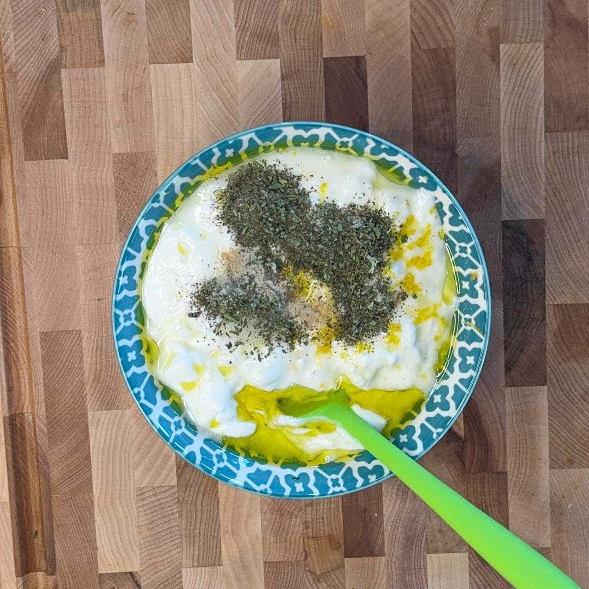 tzatziki sauce ingredients in a blue and white bowl