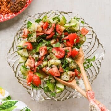 Middle Eastern salad with tongs, bulgur and meat patties
