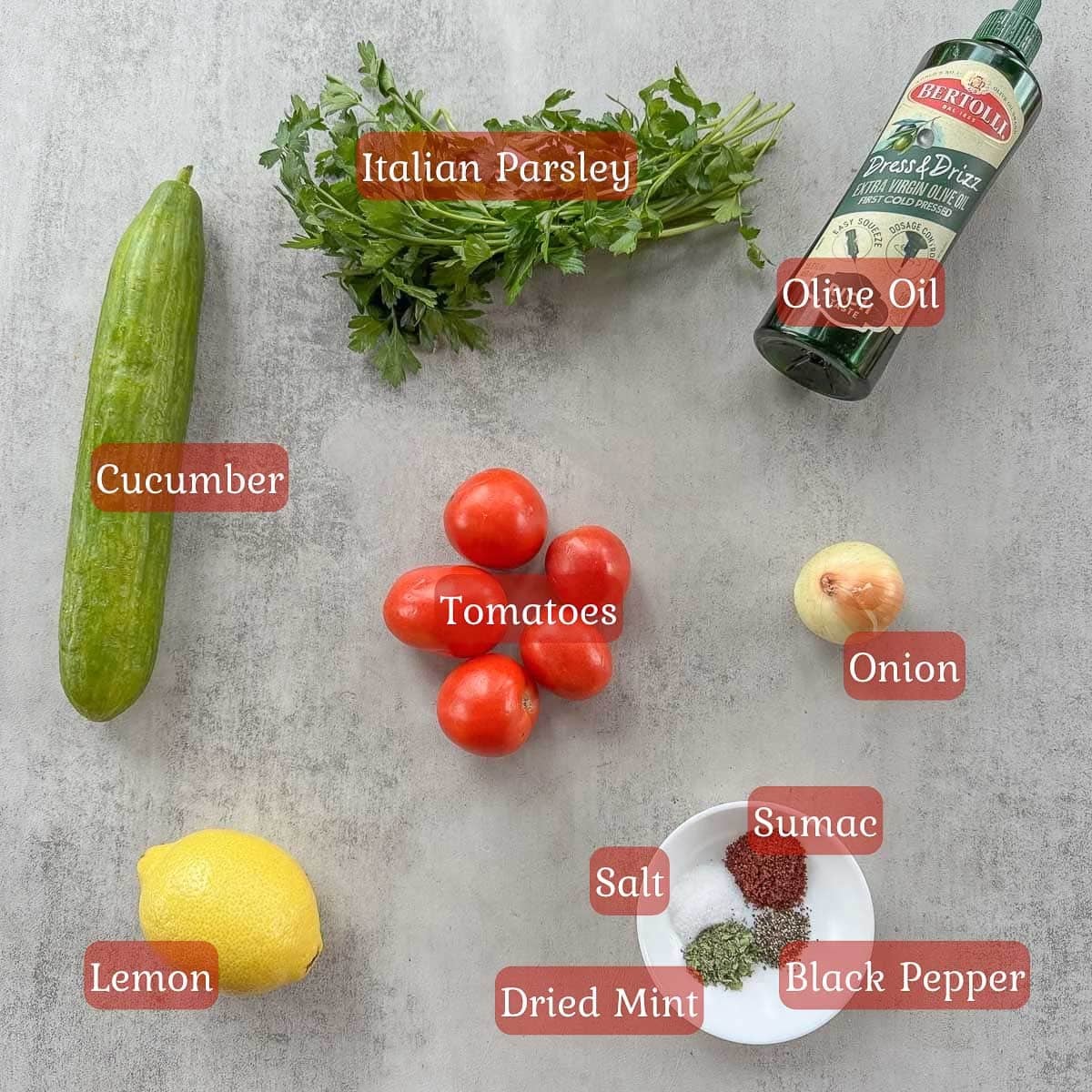 Middle Eastern salad ingredients including tomatoes, cucumbers, parsley, olive oil, and lemon