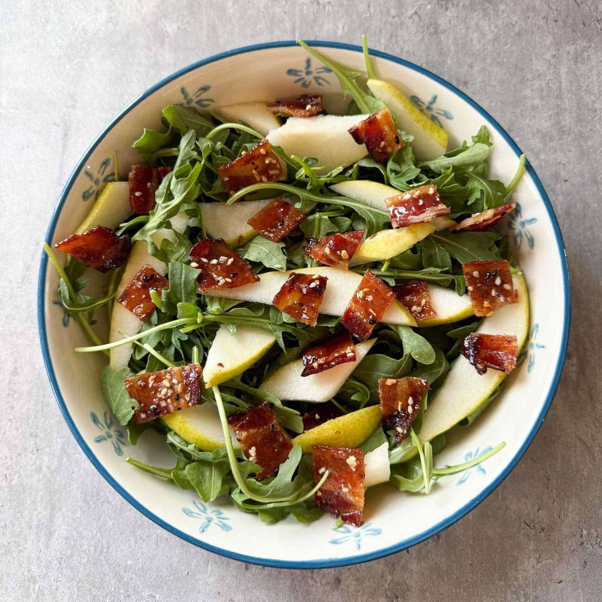 pear rocket salad base with bacon.
